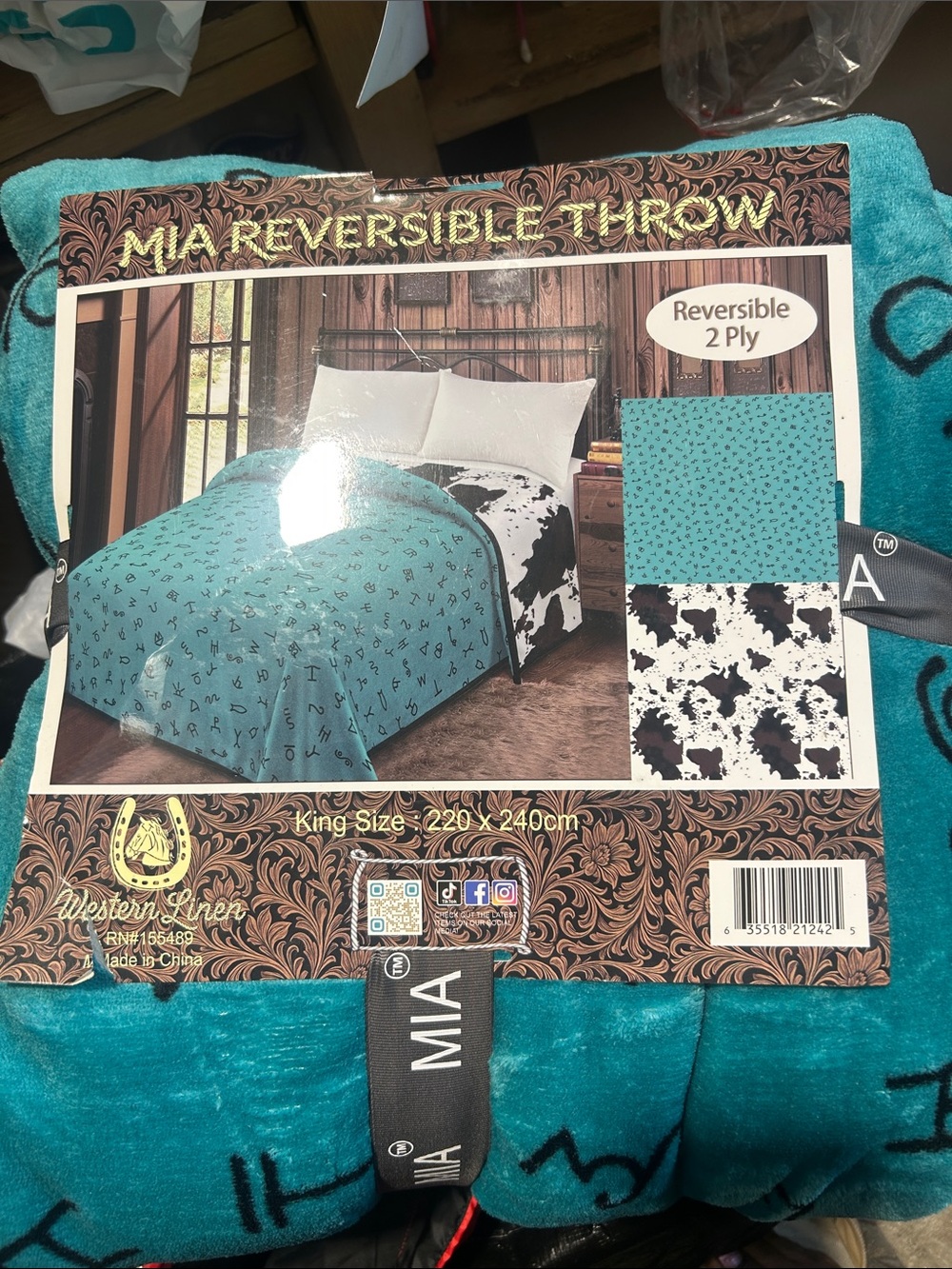 MIA Reversible Throw Blanket in Teal and Black-White Cowprint